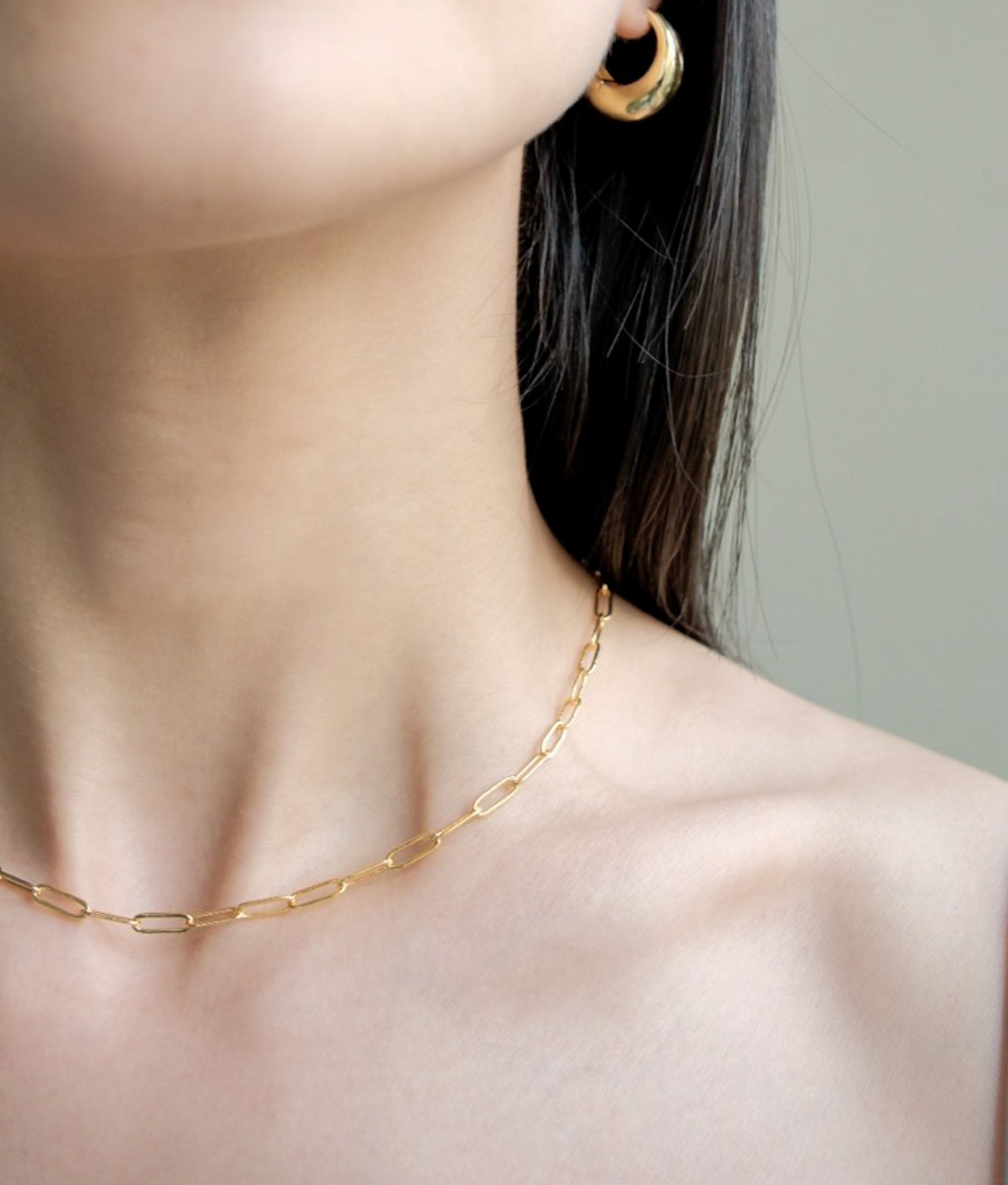 golden chain necklace on model