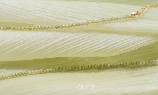 green crystal zircon necklace in natural light