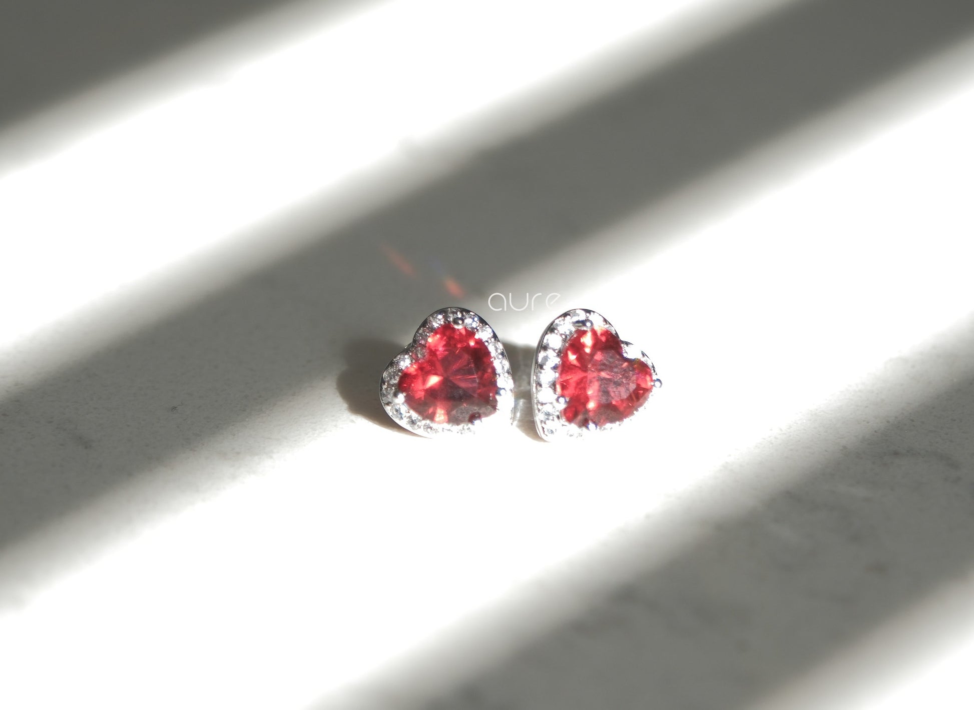 Heart-shaped ruby earrings-sun light