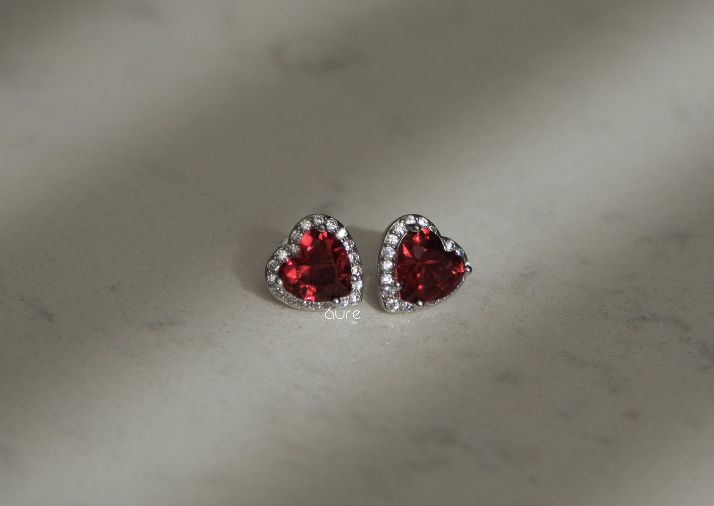 Heart-shaped ruby earrings-indoor light