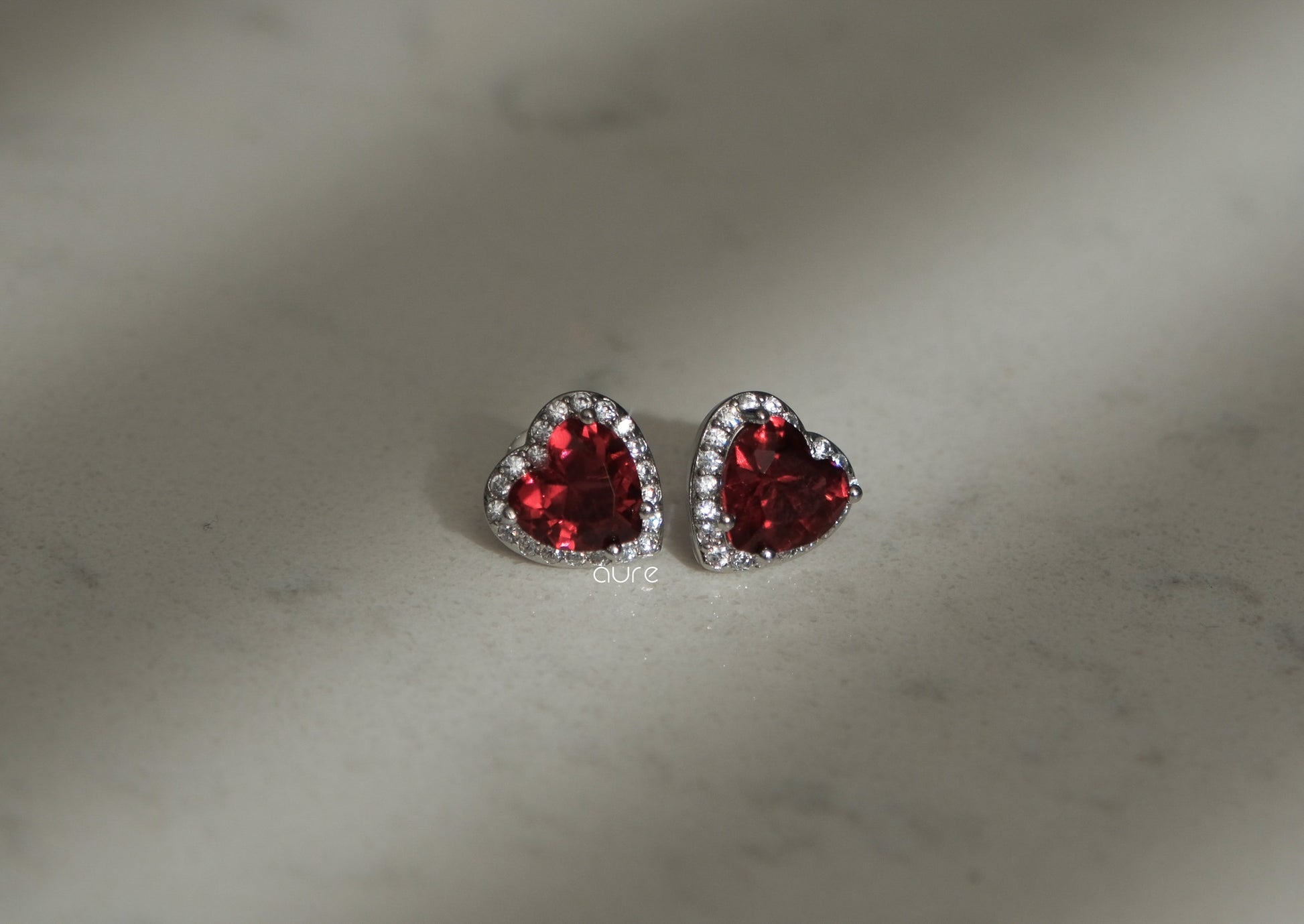 Heart-shaped ruby earrings-indoor light